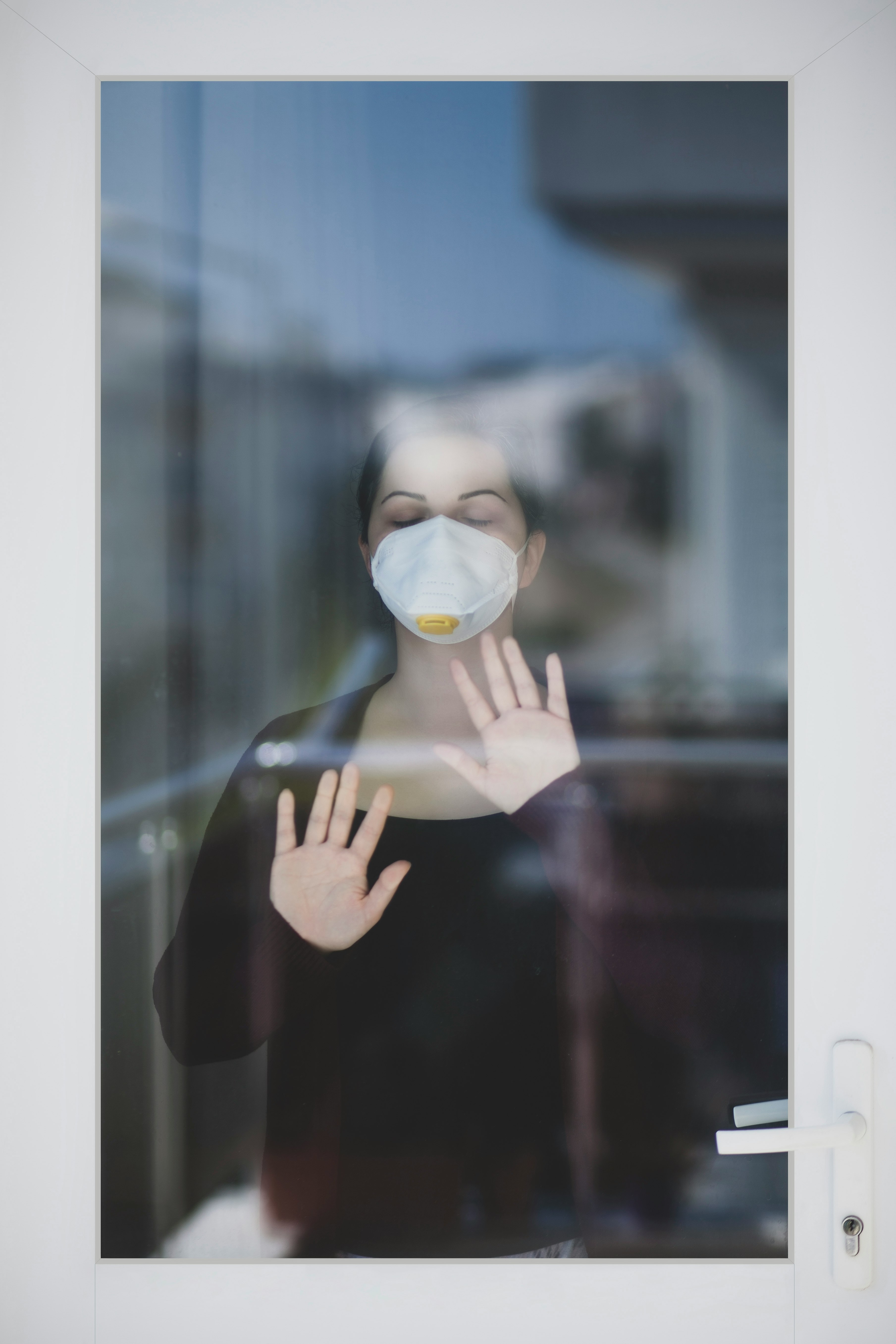 person holding white and yellow mask